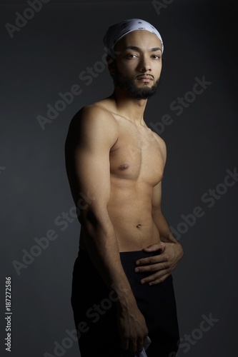 hot young african american man without shirt or bi-racial shirtless male model © Tina 