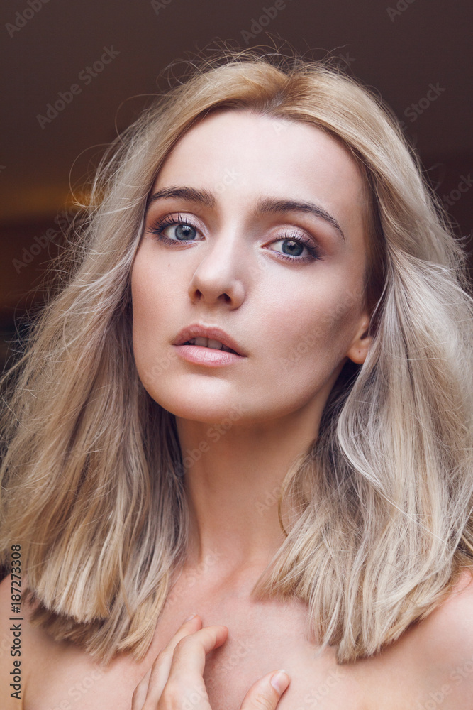 Close-up portrait of a gorgeous young blonde woman with straight cut hairstyle, green mysterious eyes looking at you through the lens, big sexy lips and completely unveiled. Close-up portrait of a gorgeous young blonde woman with straight cut hairstyle, green mysterious eyes looking at you through the lens, big sexy lips and completely unveiled.
