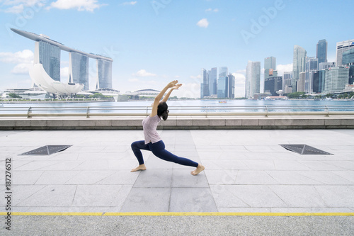 Photography Young woman doing yoga at outdoor