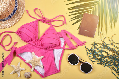Summer and Travel essentials preparation, Travel accessories, Passport, Sunglasses and swimsuit bikini.