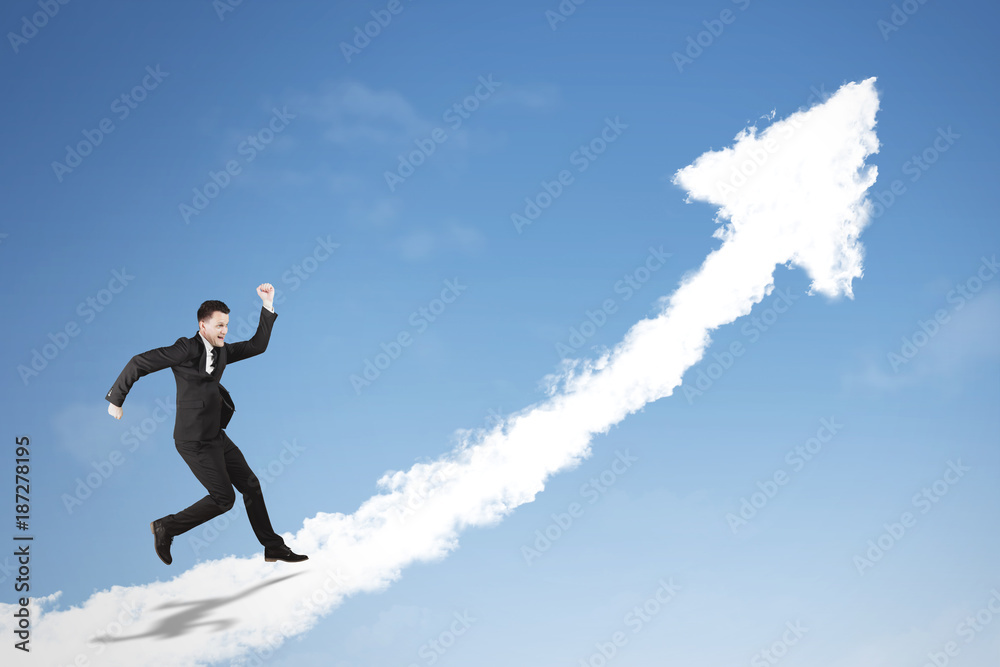 Caucasian businessman running on a cloud Caucasian businessman running on a cloud
