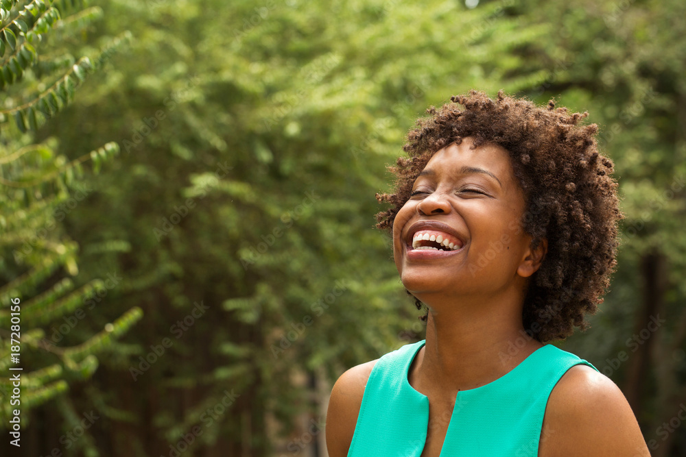 Young happy African American woman smiling. Young happy African American woman smiling.
