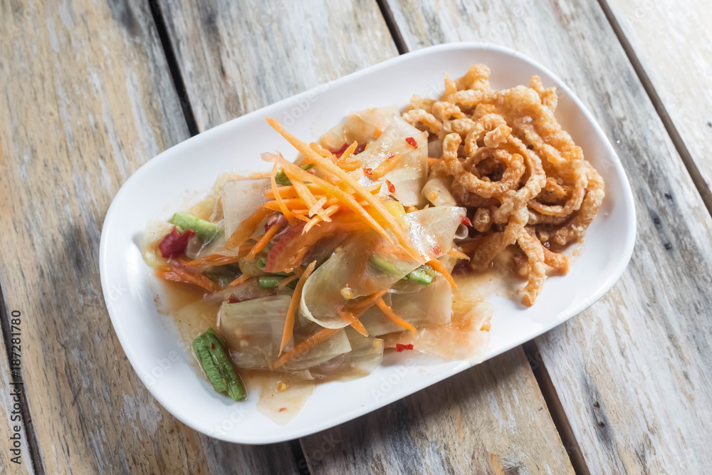 papaya salad with hot and spicy taste with vegetables for local food background papaya salad with hot and spicy taste with vegetables for local food background