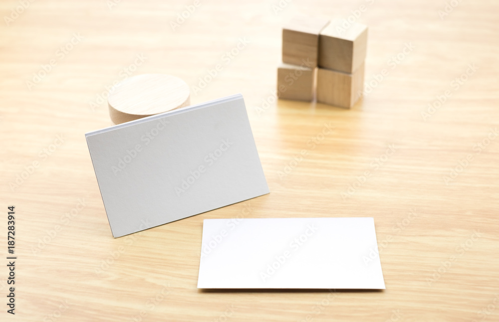 Blank business card on wood table with cube block,mock up template for adding design or text. Blank business card on wood table with cube block,mock up template for adding design or text.