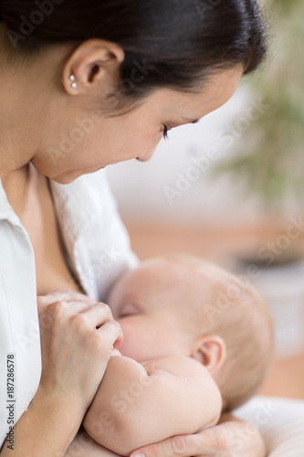 Young mother holding her ne...