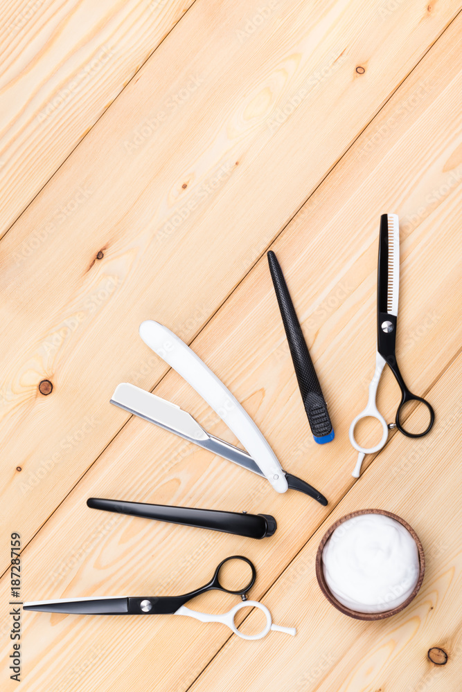 light wooden background, with the objects for the care and grooming of hair light wooden background, with the objects for the care and grooming of hair
