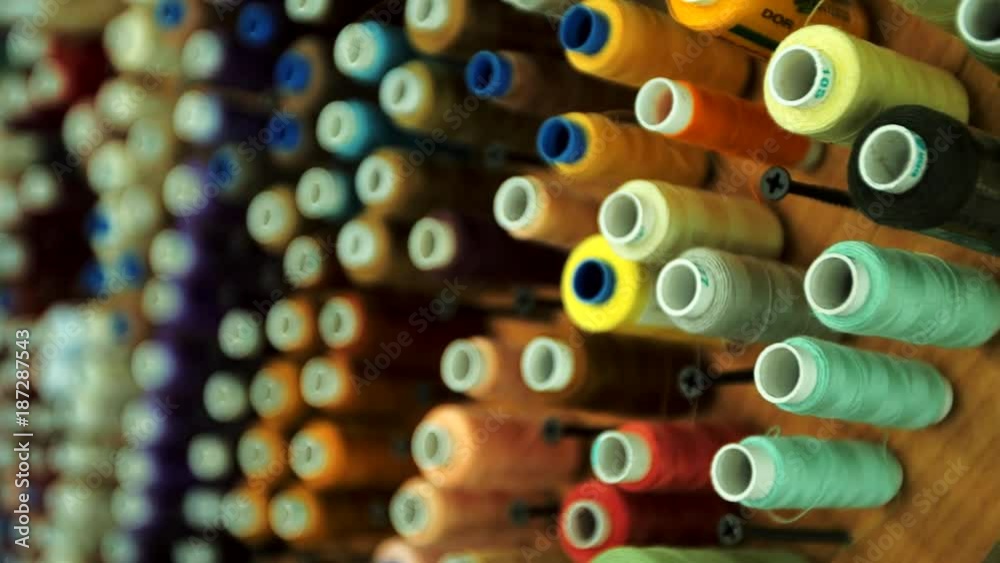 Spools of thread of different colors.