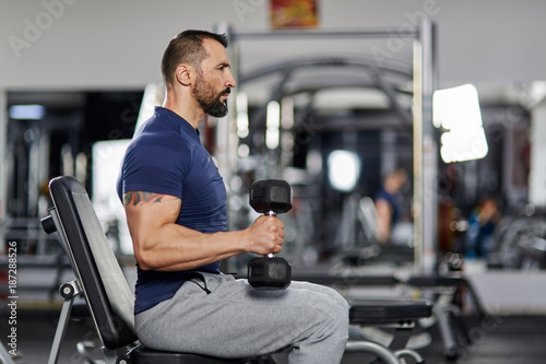 Man doing biceps curl in the gym