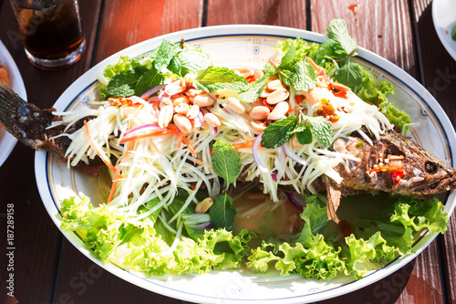 striped snakehead fish salad in restaurant
 photo