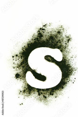 Spirulina algae. Super food concept. Letter S on Spirulina alga dry powder on white background