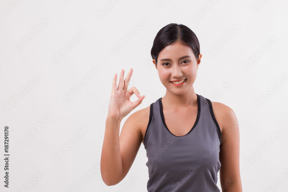 confident happy smiling fitness woman giving ok hand gesture confident happy smiling fitness woman giving ok hand gesture