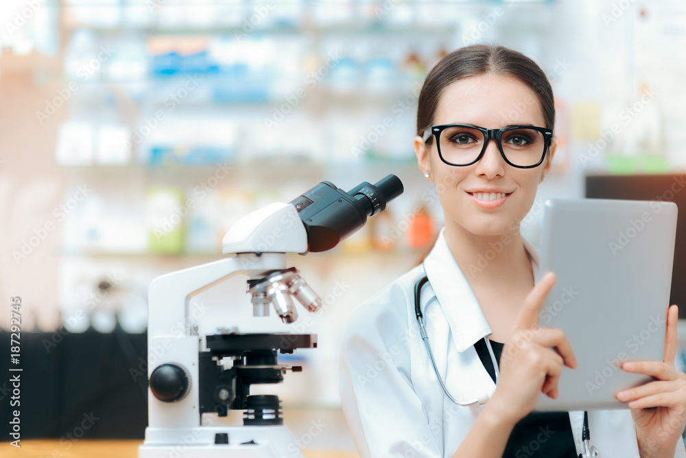 Scientist with Microscope and Pc Tablet doing Research Study 