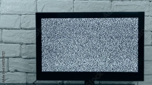 Analog TV signal with glitching effect. Loop video. Indoor Tv mock up. photo