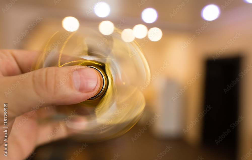 The golden spinner is spinning in his hand