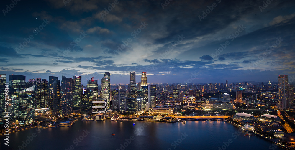 modern buildings illuminated in Singapore downtown  at dusk