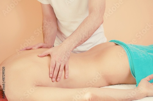 Hands making body massage 