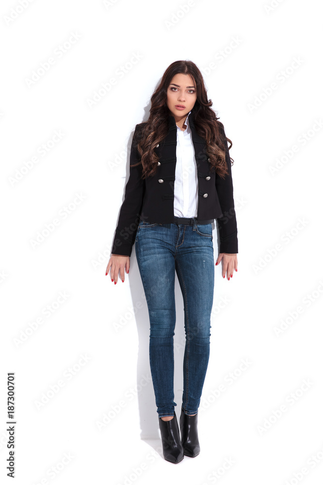 young attractive woman standing against white wall young attractive woman standing against white wall