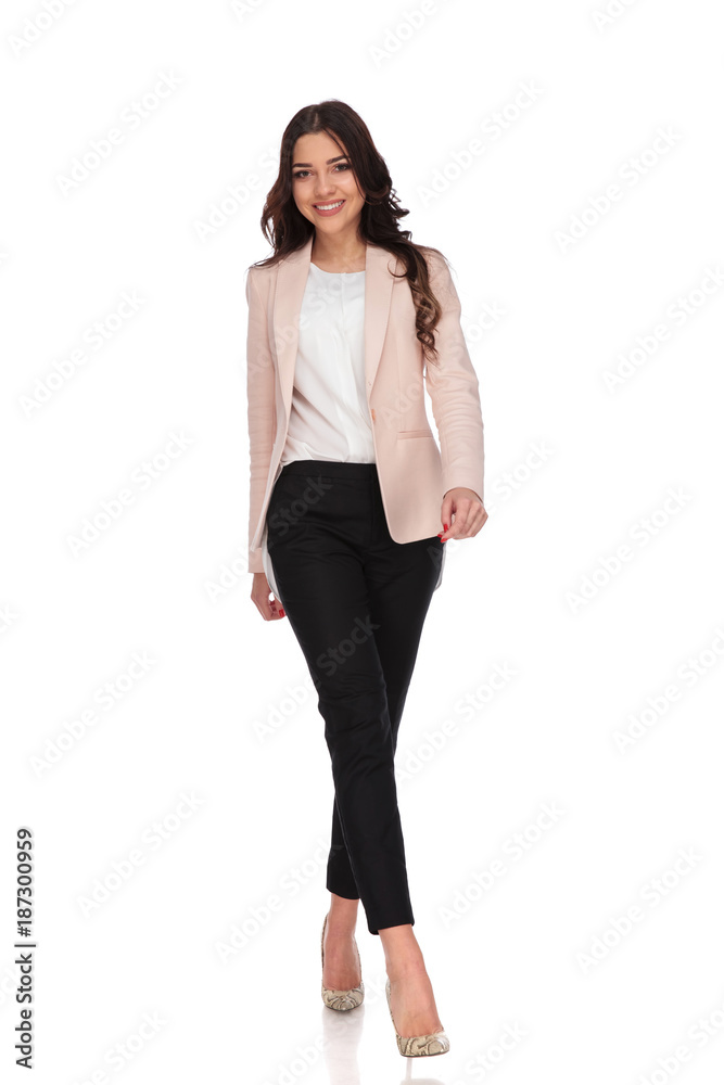 young smiling business woman is walking forward young smiling business woman is walking forward