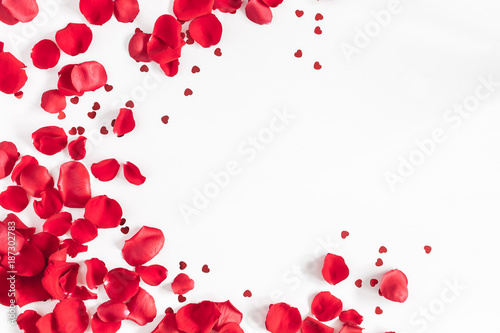 Valentine's Day. Flowers composition. Round frame made of rose flowers, confetti on white background. Valentines day background. Flat lay, top view, copy space
