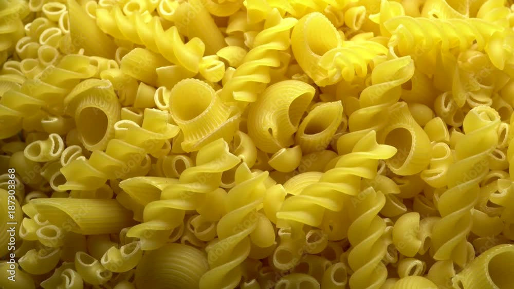 Rigati and fusilli dry pasta in rotation Rigati and fusilli dry pasta in rotation