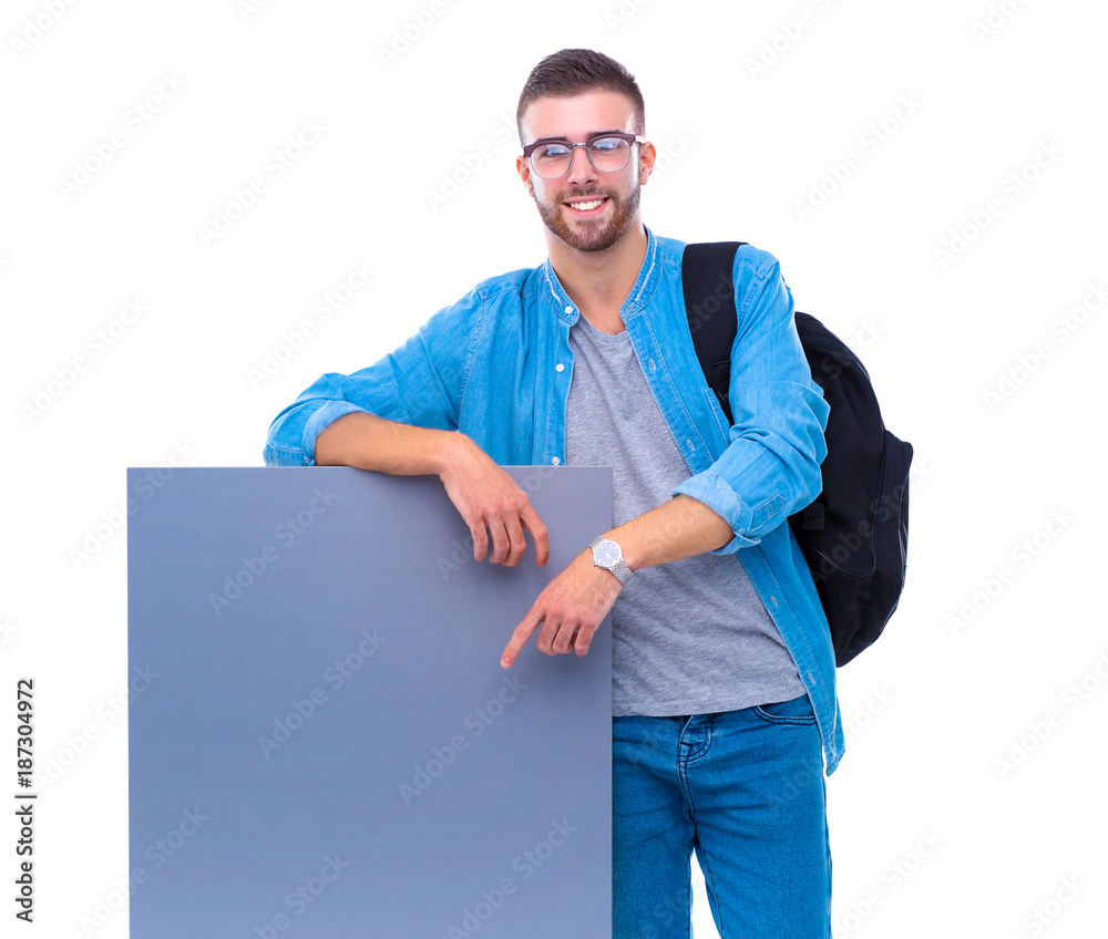 Portrait of a smiling male student holding blank board Portrait of a smiling male student holding blank board