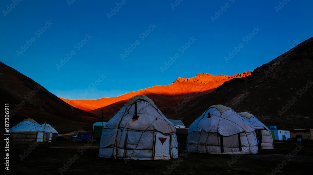 Sunrise over kyrgyz Yurts at Tash-Rabat river and valley in Naryn province, Kyrgyzstan