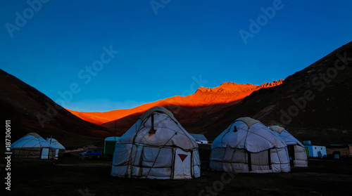 Sunrise over kyrgyz Yurts at Tash-Rabat river and valley in Naryn province, Kyrgyzstan photo