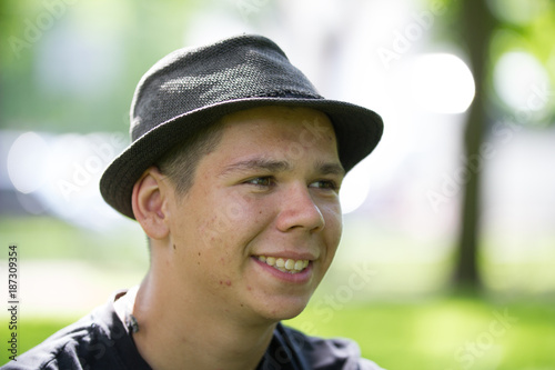 Portrait of a young man tourists in hat - pimply face