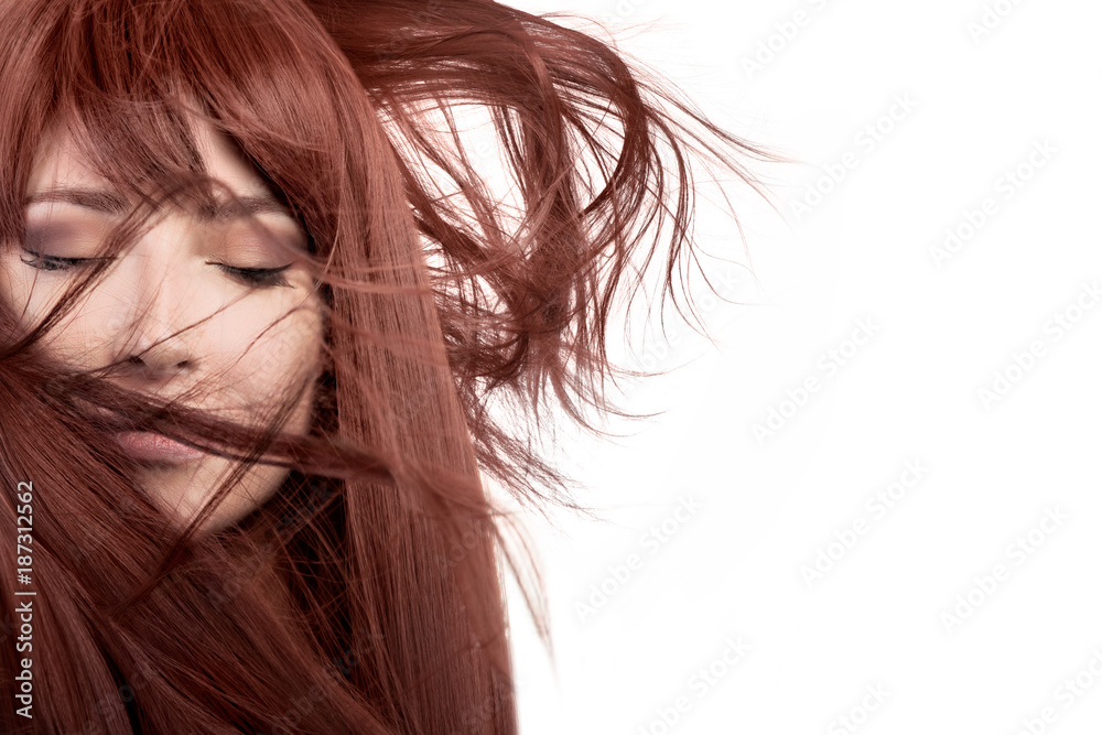Beauty model with healthy long hair blowing over face