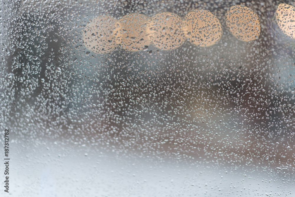 Rain. Autumn seasonal background with rain drops on the window. Autumn cold weather with rain and wind. Abstract colorful background. Rain. Autumn seasonal background with rain drops on the window. Autumn cold weather with rain and wind. Abstract colorful background.