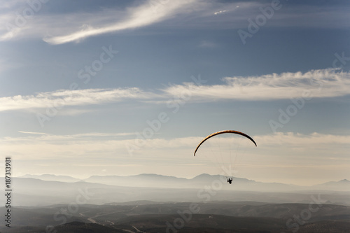 Man practicing paragliding extreme sport