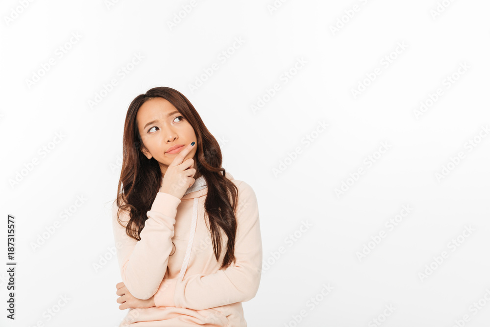 Asian thinking lady standing isolated Asian thinking lady standing isolated