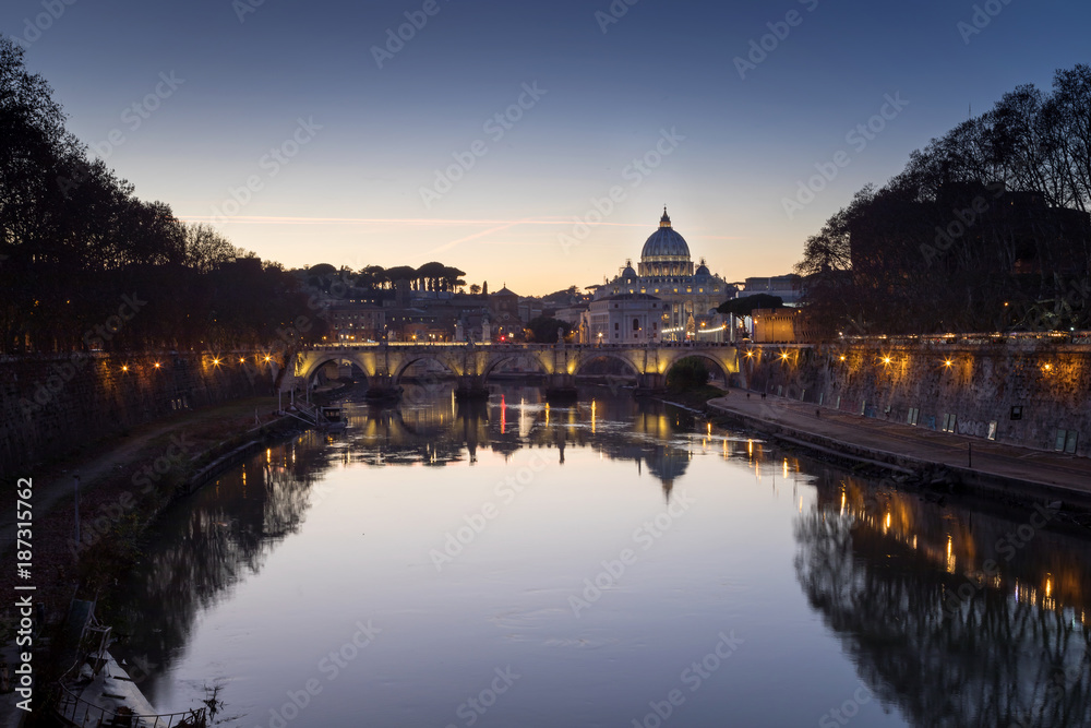 Tiber River, San Pietro and Sant'Angelo bridge. Rome cityscape at sunset.