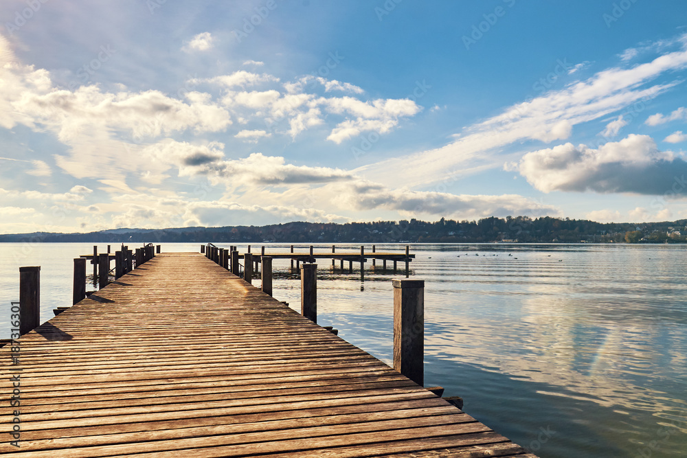 Empty wooden pier on Lake Starnberg in Bavaria, Germany