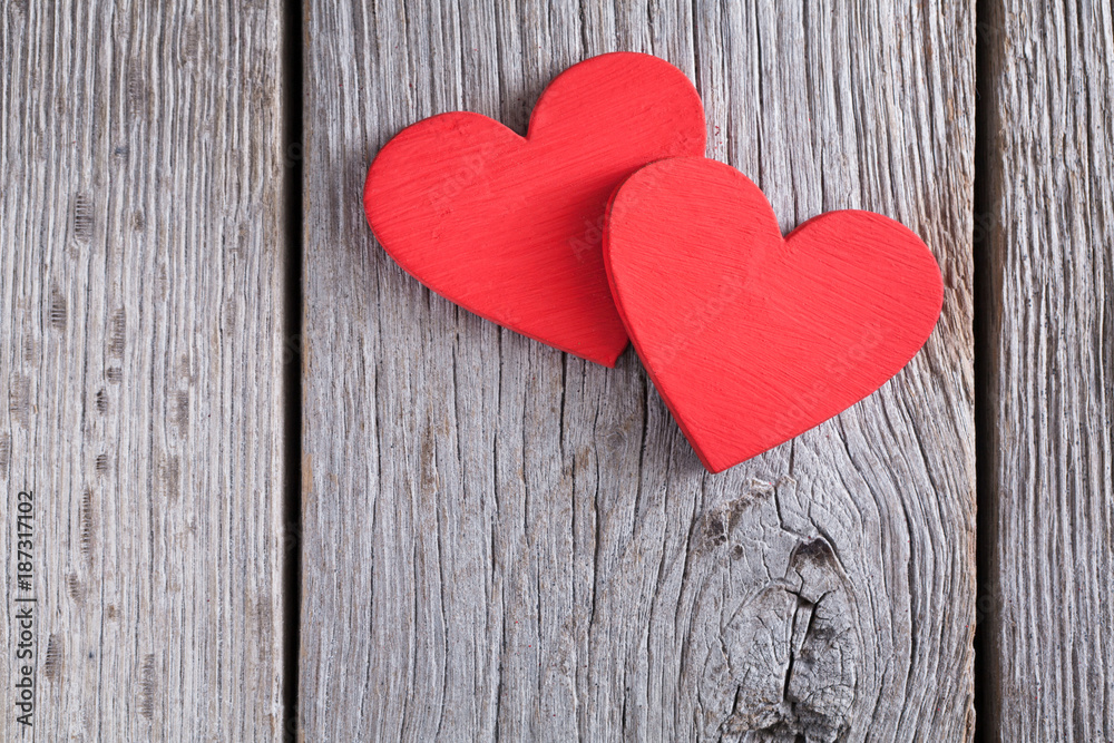Valentine background with handmade hearts on rustic wood Valentine background with handmade hearts on rustic wood