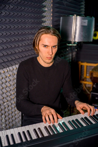 Musician in a recording studio © Nichizhenova Elena