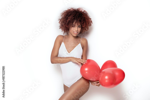 African american girl with heart shaped baloons. © neonshot