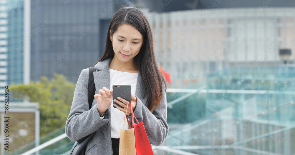 Woman use of mobile phone in city Woman use of mobile phone in city