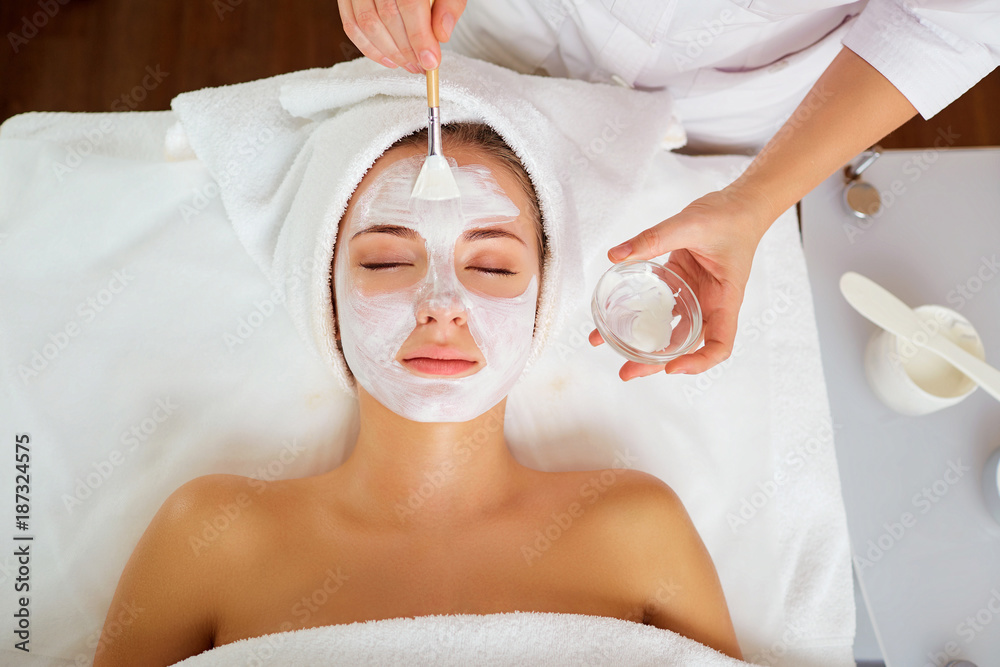 Woman in mask on face in spa beauty salon. - obrazy, fototapety, plakaty 