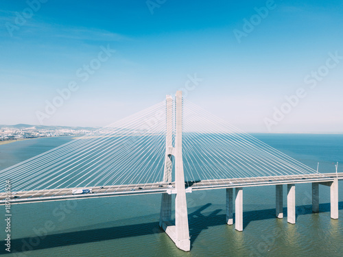 Fototapeta Naklejka Na Ścianę i Meble -  Aerial View Of Vasco da Gama Bridge And High Car Traffic In Lisbon City Of Portugal