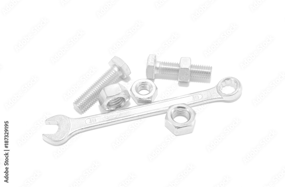 Bolt, nut and wrench on white background close-up Bolt, nut and wrench on white background close-up