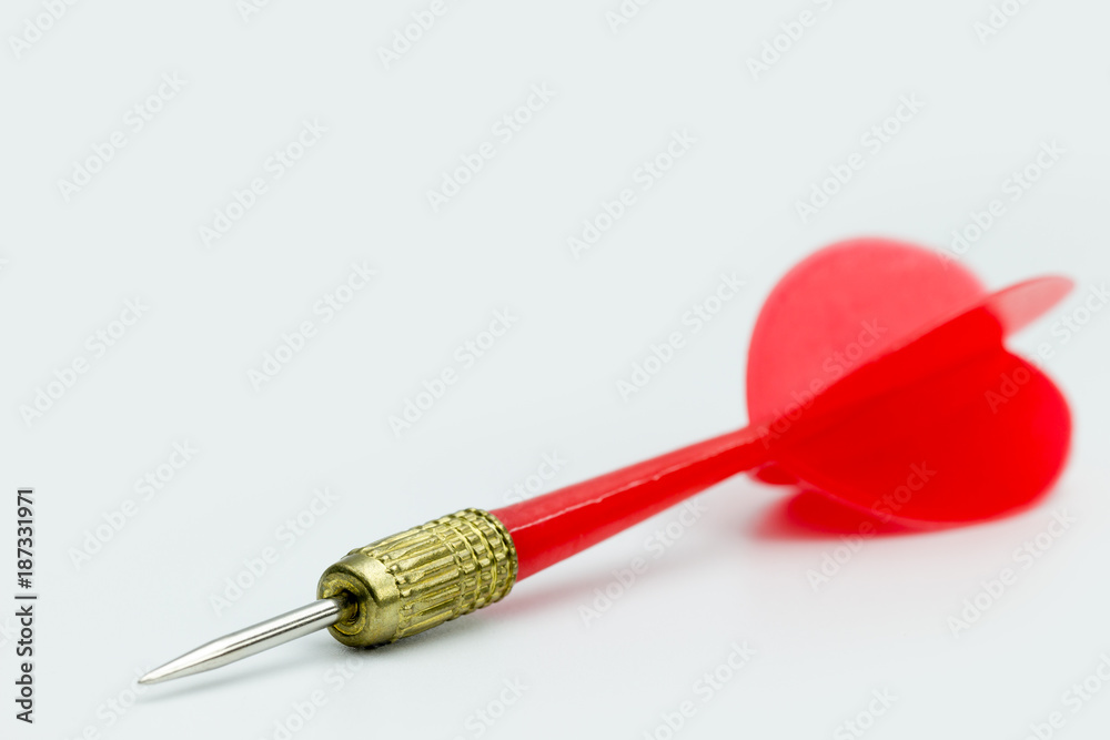Closeup sharp red darts laying on white background. Closeup sharp red darts laying on white background.