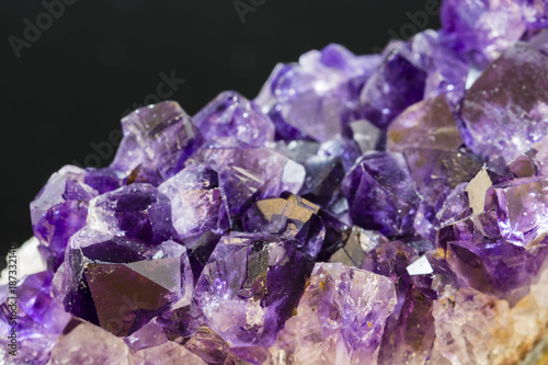 Crystal of amethyst with glistening purple color.