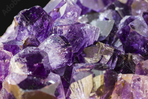 Crystal of amethyst with glistening purple color.