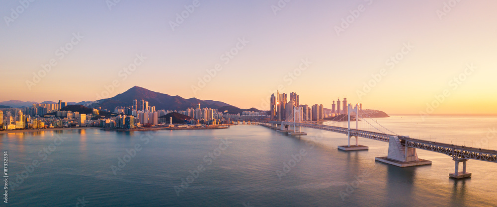 Gwangan Bridge and Haeundae aerial view at Sunrise, Busan, South Korea.