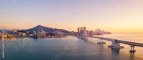 Gwangan Bridge and Haeundae aerial view at Sunrise, Busan, South Korea.