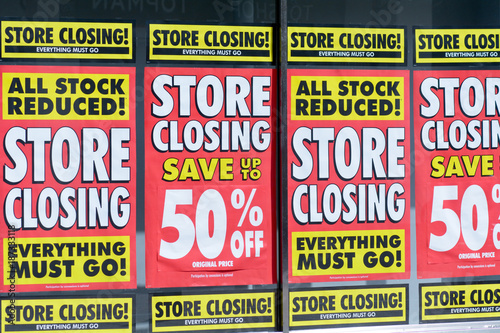 Store Closing signs shop window in Bedford, Bedfordshire, England