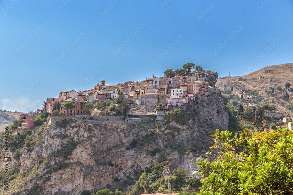 Taormina, Sicily, Italy. At the top of the cliff is the town of Castelmola