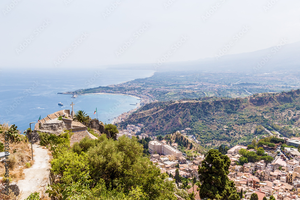 Fototapeta premium Taormina, Sicily, Italy. The Church of Madonna della Rocca (circa 1640), towering above the picturesque sea coast