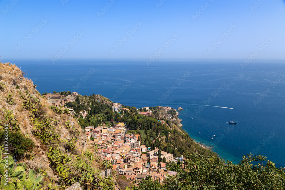 Taormina, Sicily, Italy. View of the city and the ruins of the ancient Greek theater from Mount Monte Tauro